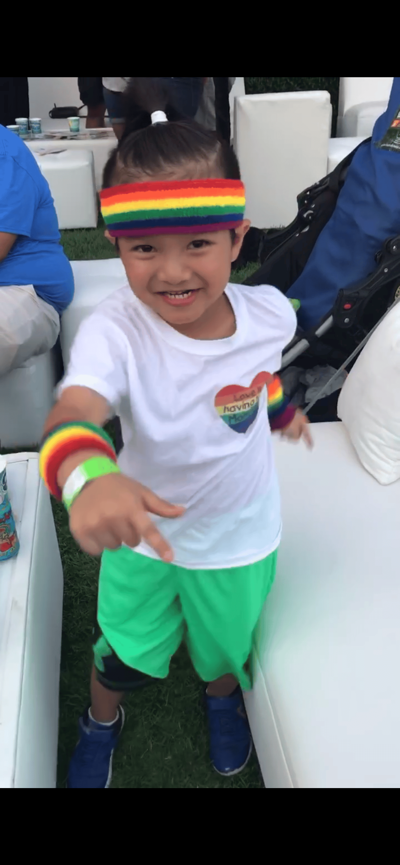 A little boy dances at Rainbow on the Green at Discovery Green