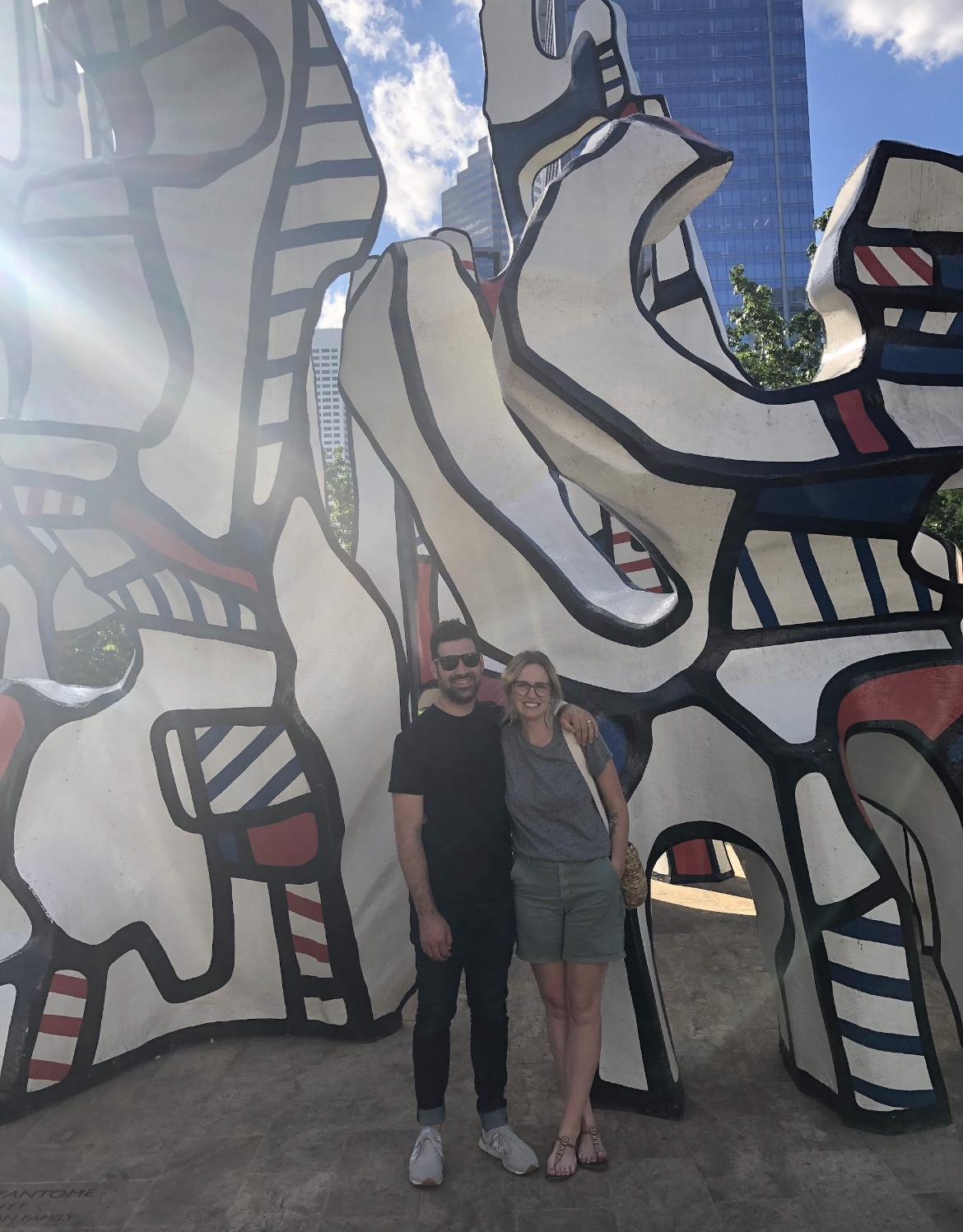 Lauren Hiser and her partner at the Dubuffet statue at Discovery Green