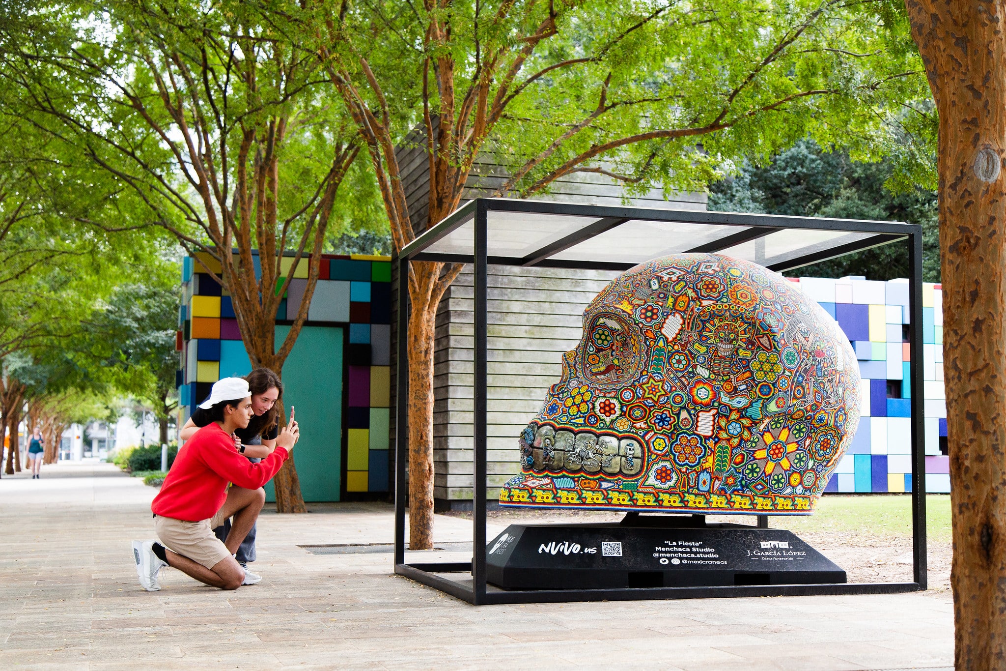 vibrantly colored skulls on display at Discovery Green