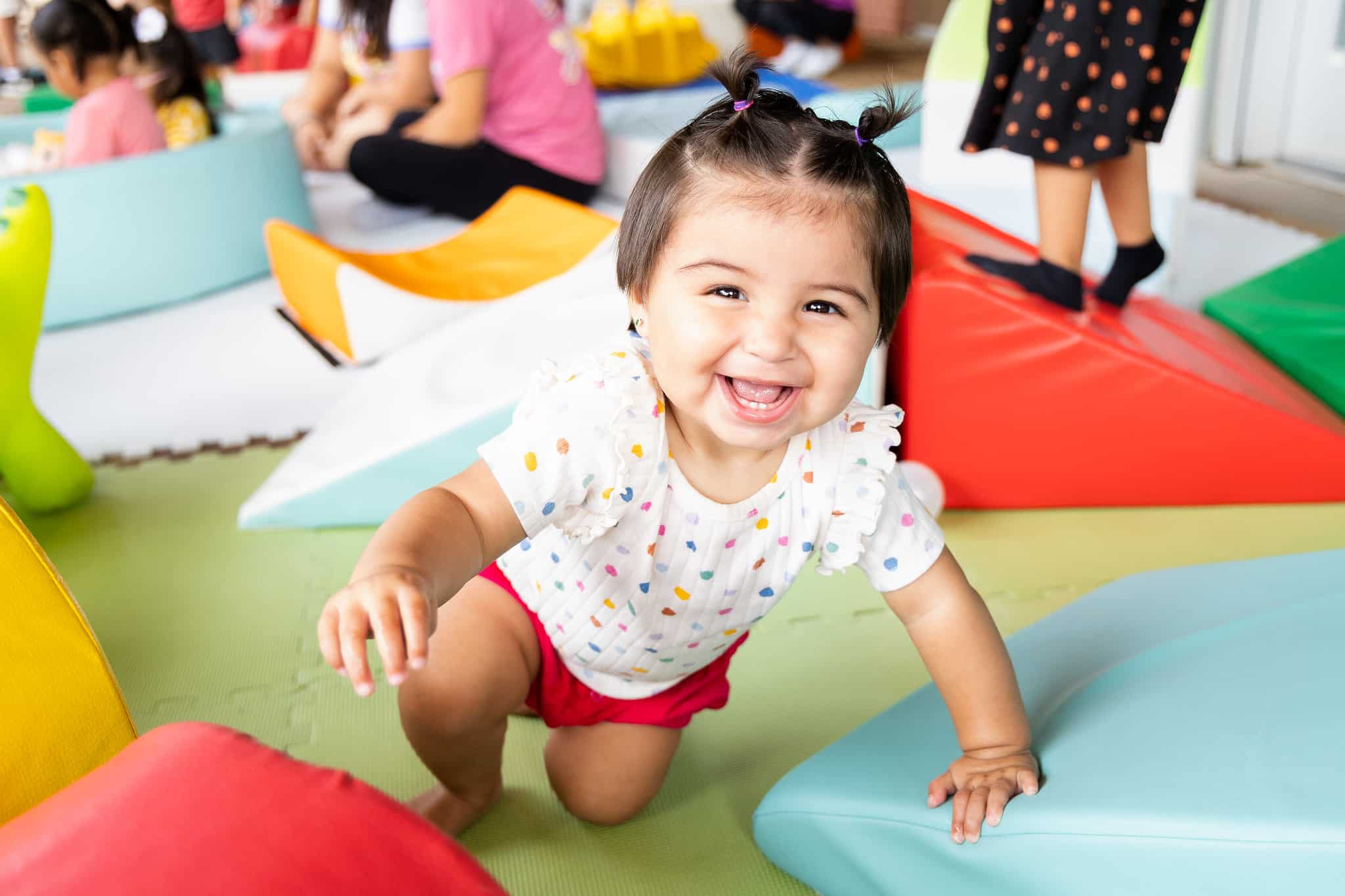 Little girl enjoys soft play equipment at Discovery Green