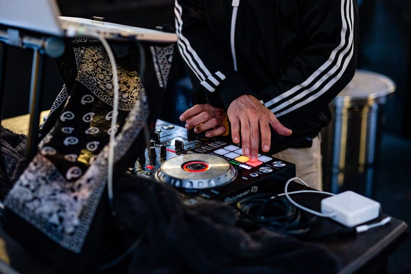 A DJ mixing music at the Roller Rink in Downtown Houston