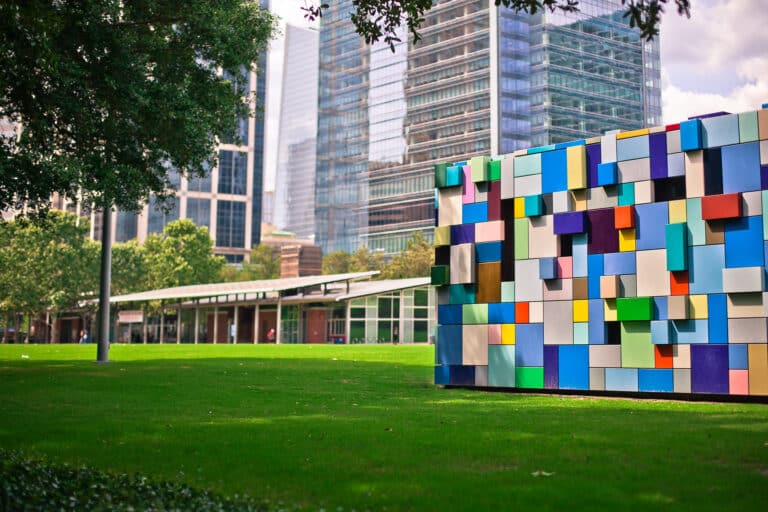 The blue Synchronicity boxes, a colorful sculpture by Margo Sawyer, are seen at Discovery Green in downtown Houston