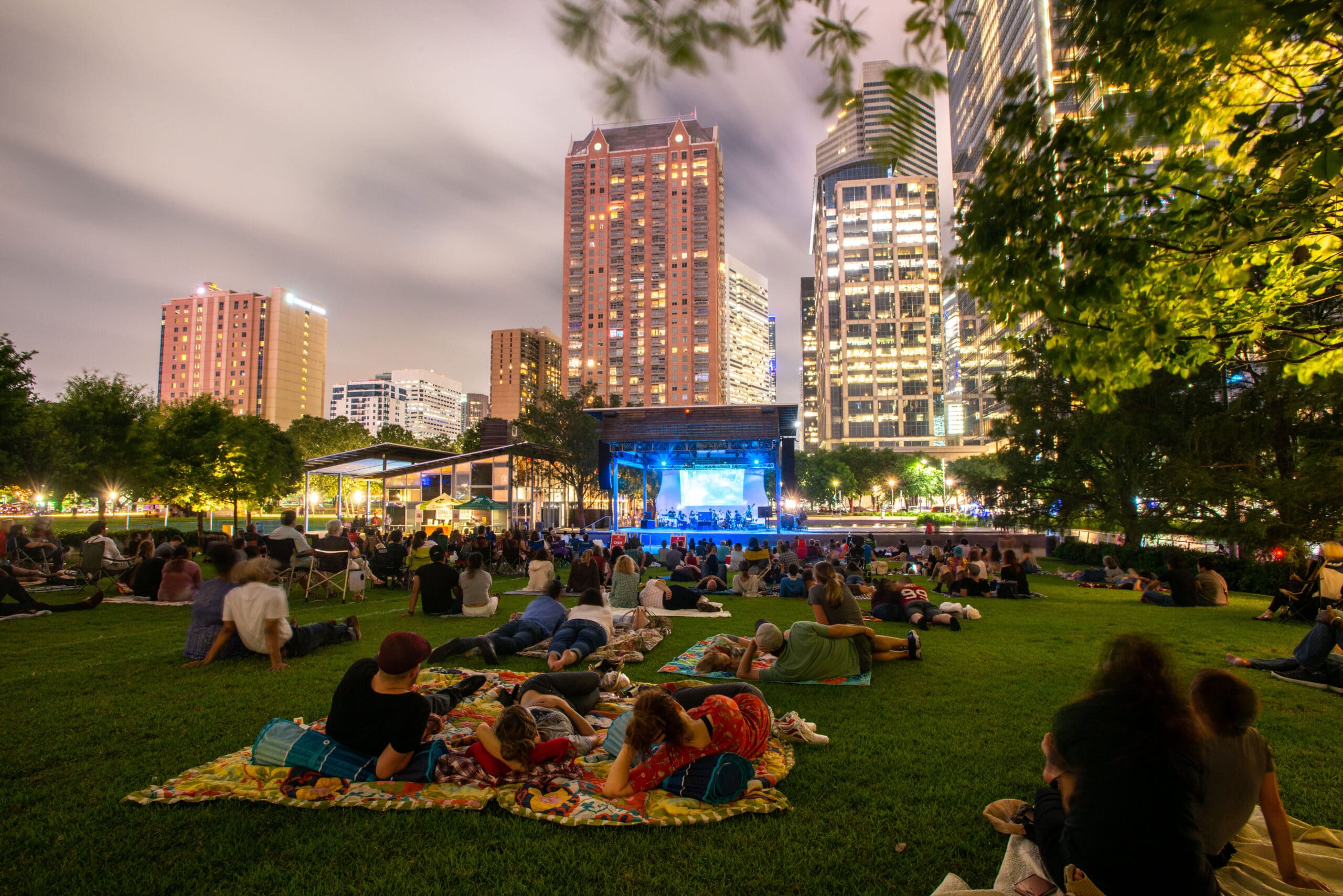 Houstonians enjoying free outdoor movies at Discovery Green in Downtown Houston