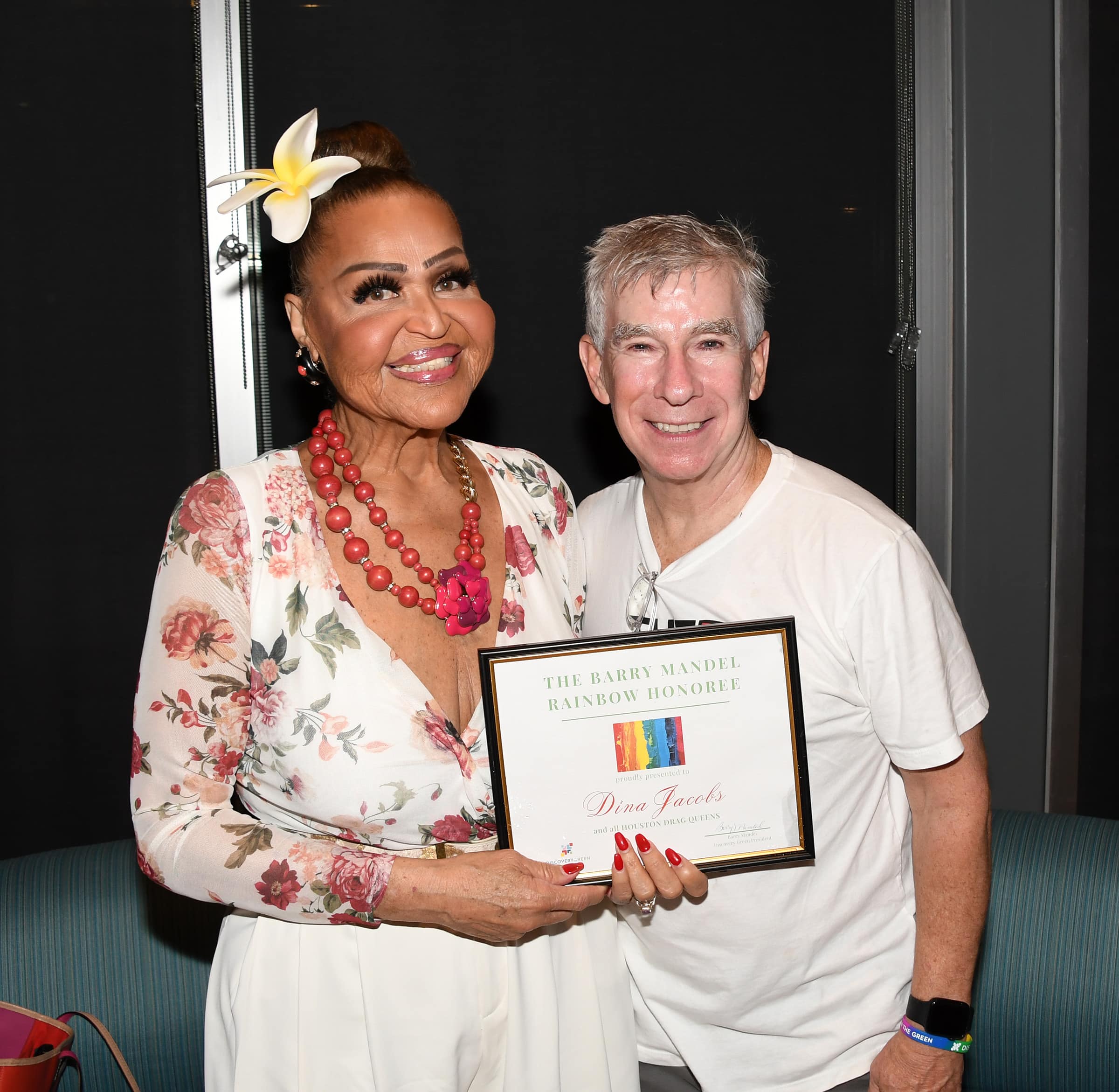 Dina Jacobs poses with Barry Mandel's husband, Scott Sawyer during the rained-out Rainbow on the Green. Photo by Dalton DeHart and Crew.