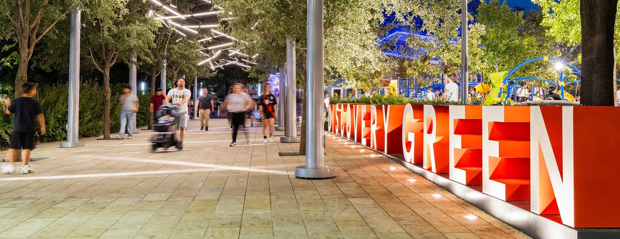 The new lights at the entryway to Discovery Green are seen in this photo to promote Park After Dark. Photo by Lawrence Elizabeth Knox.