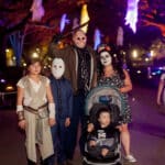 A group of people in Halloween costumes at event