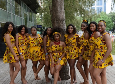 Performers pose by the stage at Discovery Green before the Igbo Festival in downtown Houston
