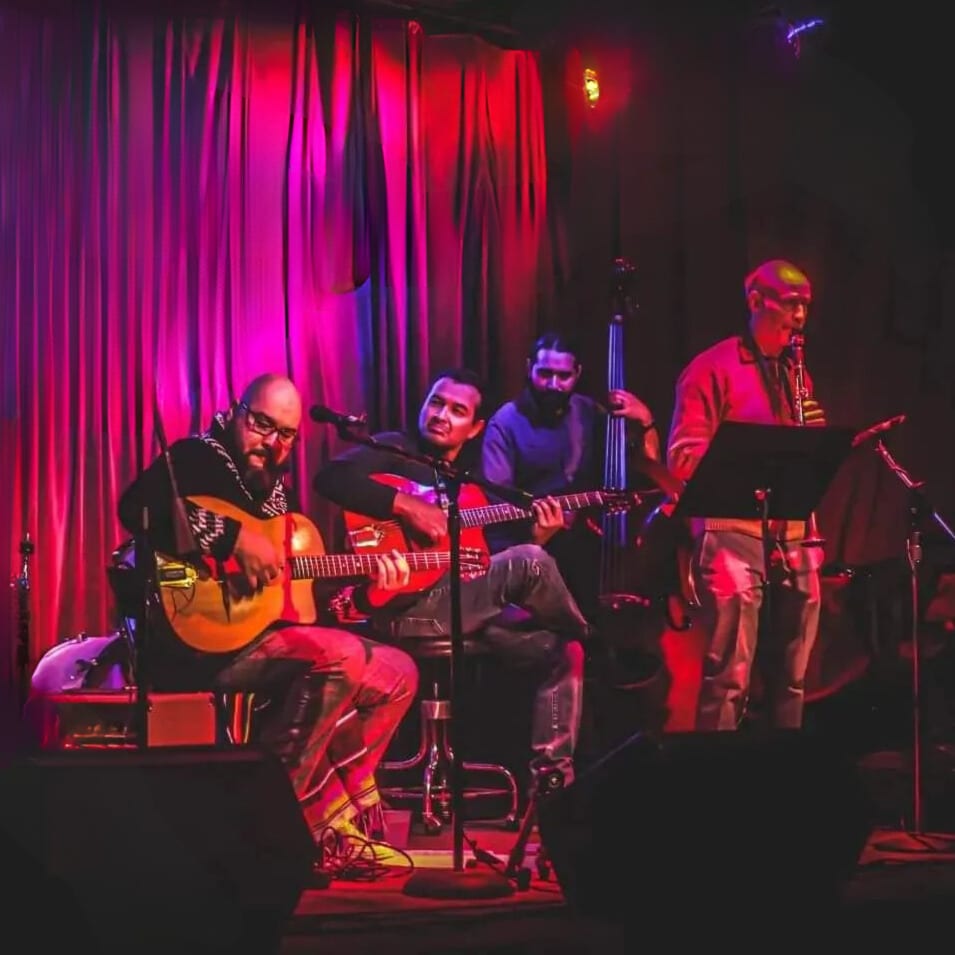 Photo of musicians The Pew performing on a stage