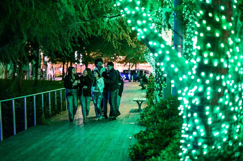 Young adults roaming Discovery Green during Frostival.